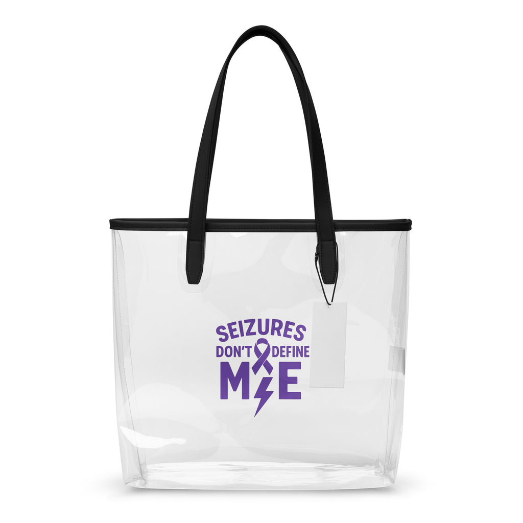 Clear tote bag with black handles featuring a purple ribbon and text on a white background